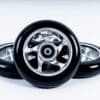 Set of three universal rollerski wheels, showcasing their sleek design, high-performance construction, and compatibility with brands like FF, IDT, Swenor, Swix, and Fischer.