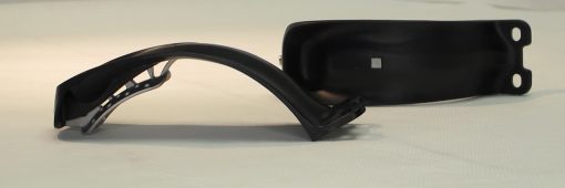 FF skate brake mounted above rear roller ski wheel