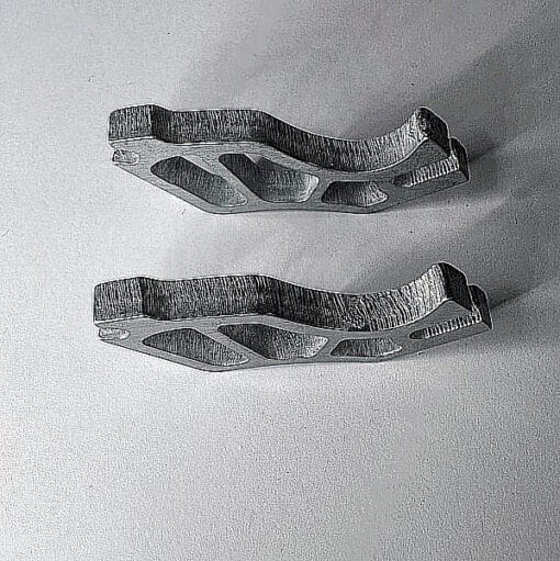 Two metallic ski brake blades displayed ffskis rollerskis