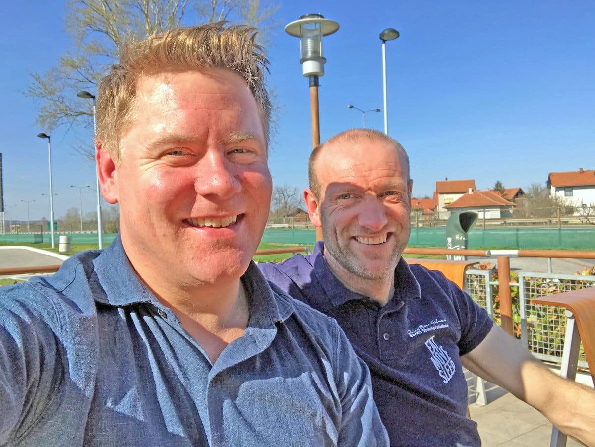 Odd Bjørn Hjelmeseth og Henrik smiling outdoors while discussing the development of high-end FF Rollerskis gear.