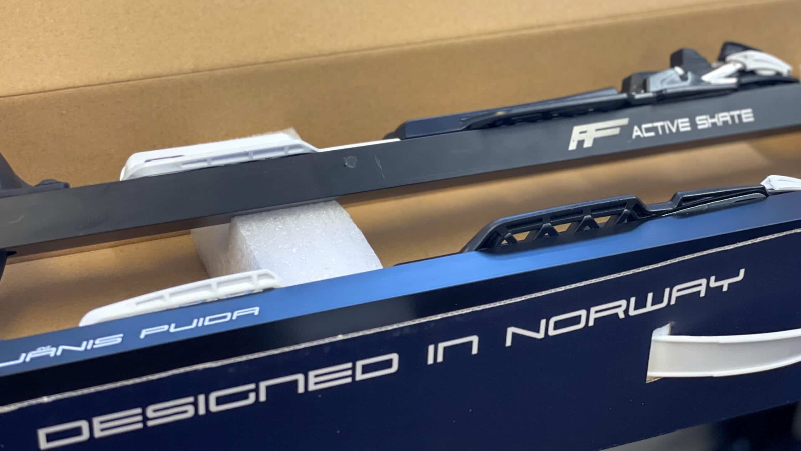 Two FF Rollerskis neatly placed inside a branded box, ready for delivery.