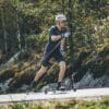 Skier using FF V Pro Classic rollerskis on a track, showcasing stability and high performance.